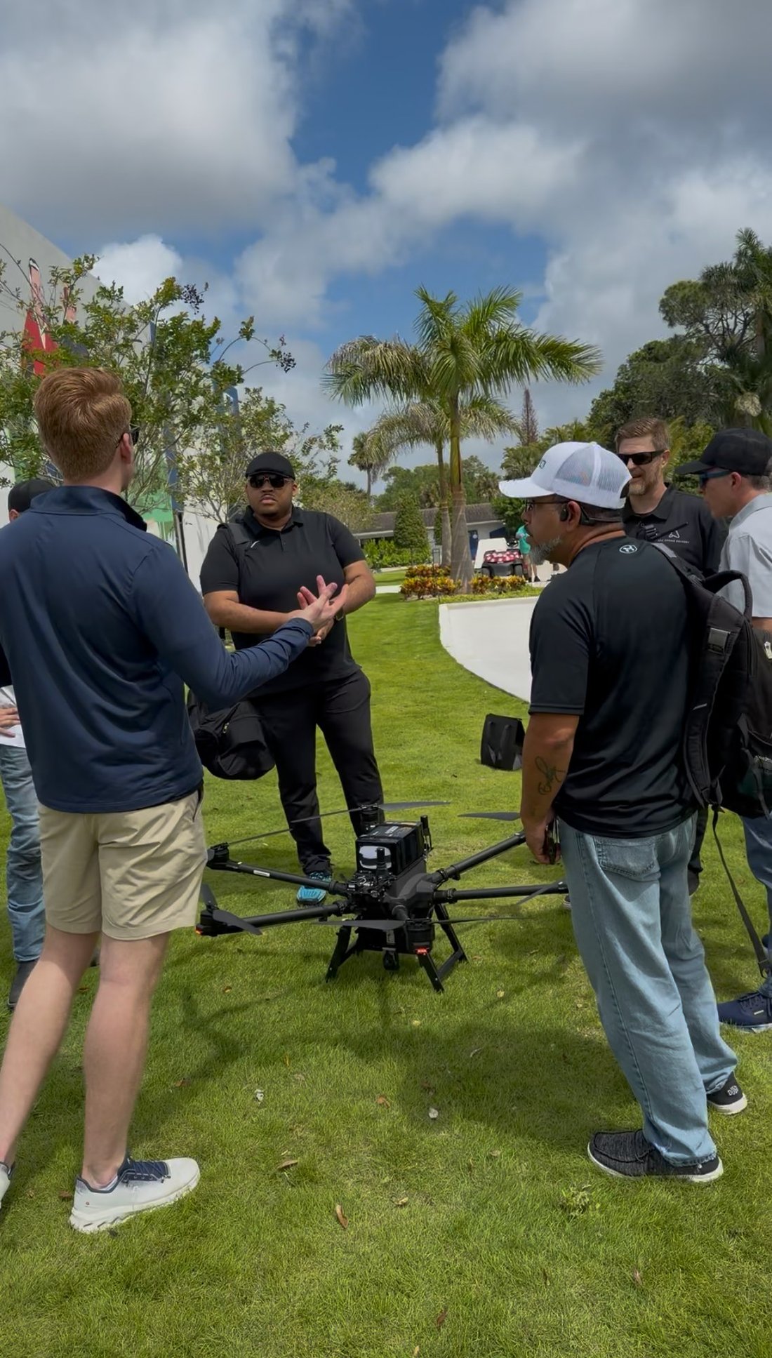 Rivo team walking operators through a drone on the lawn