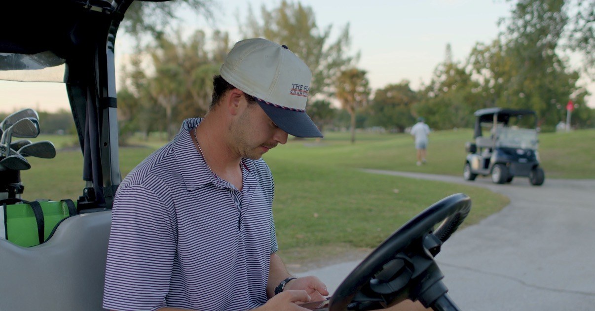 Golfer placing an order from the golf cart